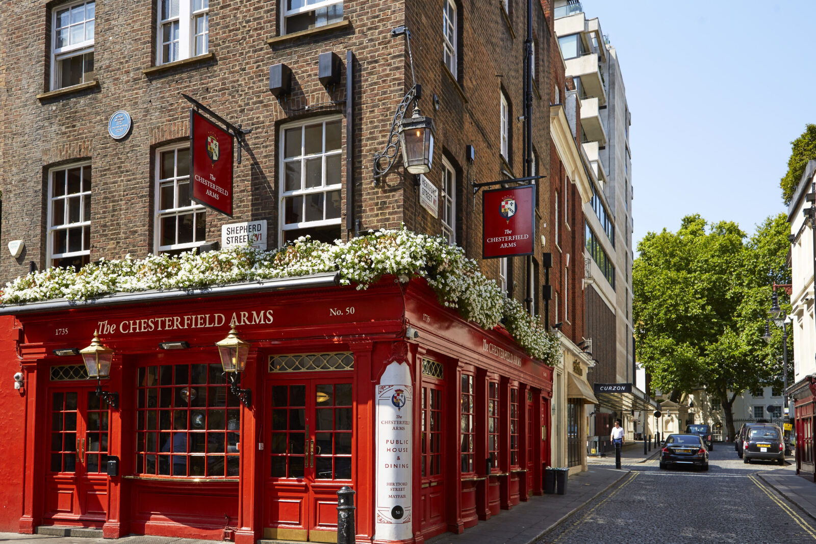 The red painted exterior of historic The Chesterfield Arms pub on the corner of Hertford Street.