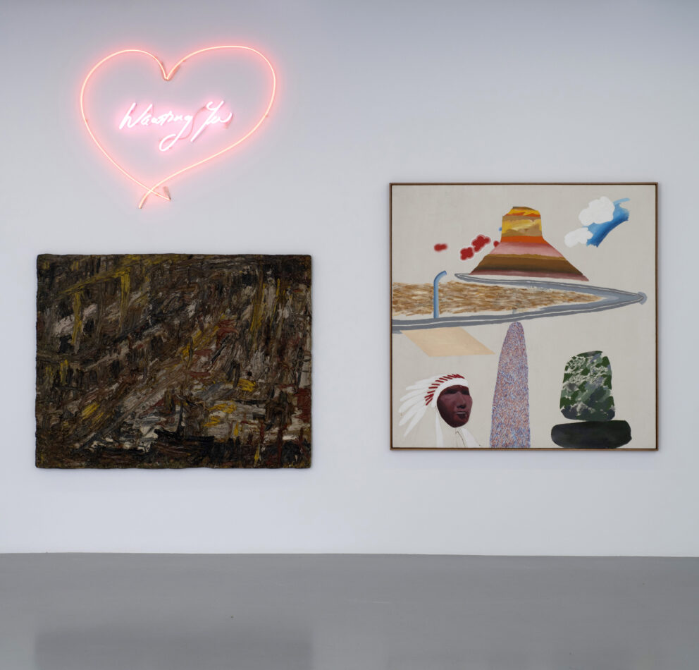 The white wall of the Saatchi Yates gallery for the exhibition Once Upon a Time in London, with a heart shaped neon sign, a dark painting and a light painting with bold colours and shapes.