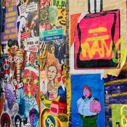 A wall of brightly coloured graffiti including a perfume bottle and characters.