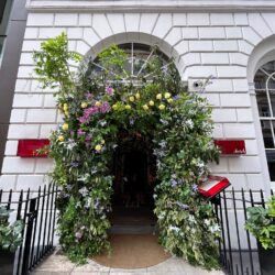 The entrance to Sketch on Conduit Street with the doorway adorned with flowers.