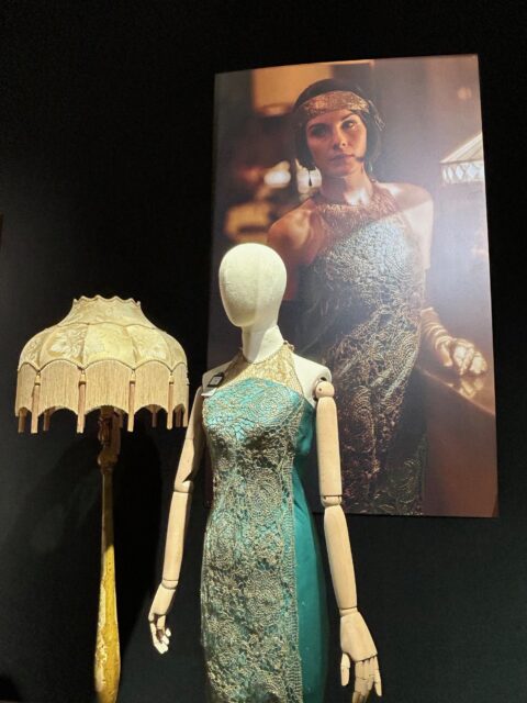 A sea green and golden dress costume on display at Bonhams' Downton Abbey auction.