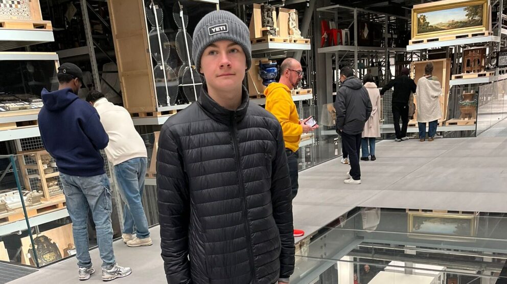 The interior of the V&A East Storehouse with exposed shelves and flooring.