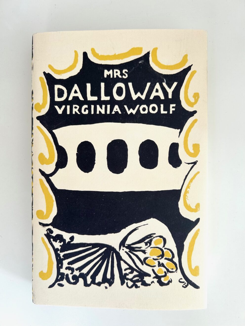 The front cover of Virginia Woolf's Mrs Dalloway with Vanessa Bell's black and yellow stylised design.