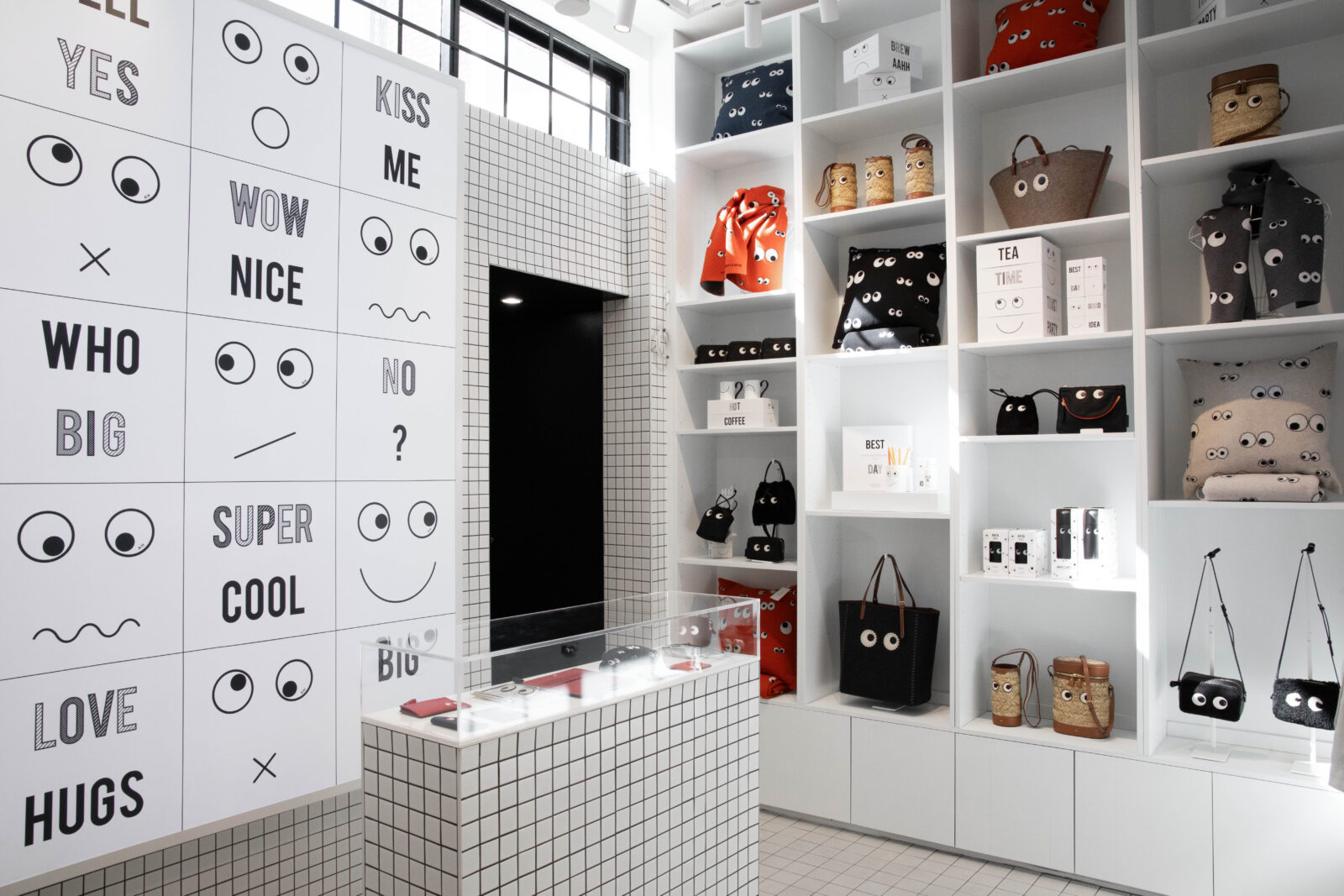 The interior of the Anya Life shop in Chelsea, with white shelves lined with accessories showing the iconic Eyes Edit.