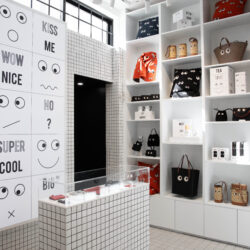 The interior of the Anya Life shop in Chelsea, with white shelves lined with accessories showing the iconic Eyes Edit.