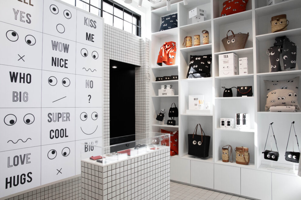 The interior of the Anya Life shop in Chelsea, with white shelves lined with accessories showing the iconic Eyes Edit.