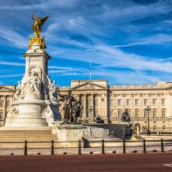 The exterior of Buckingham Palace with the Victoria Memorial in the foreground